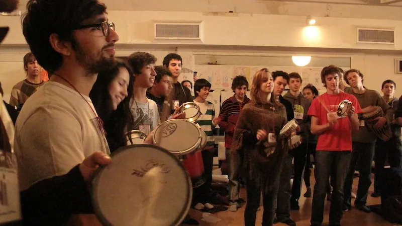A group sitting in a circle for a guided breathwork session