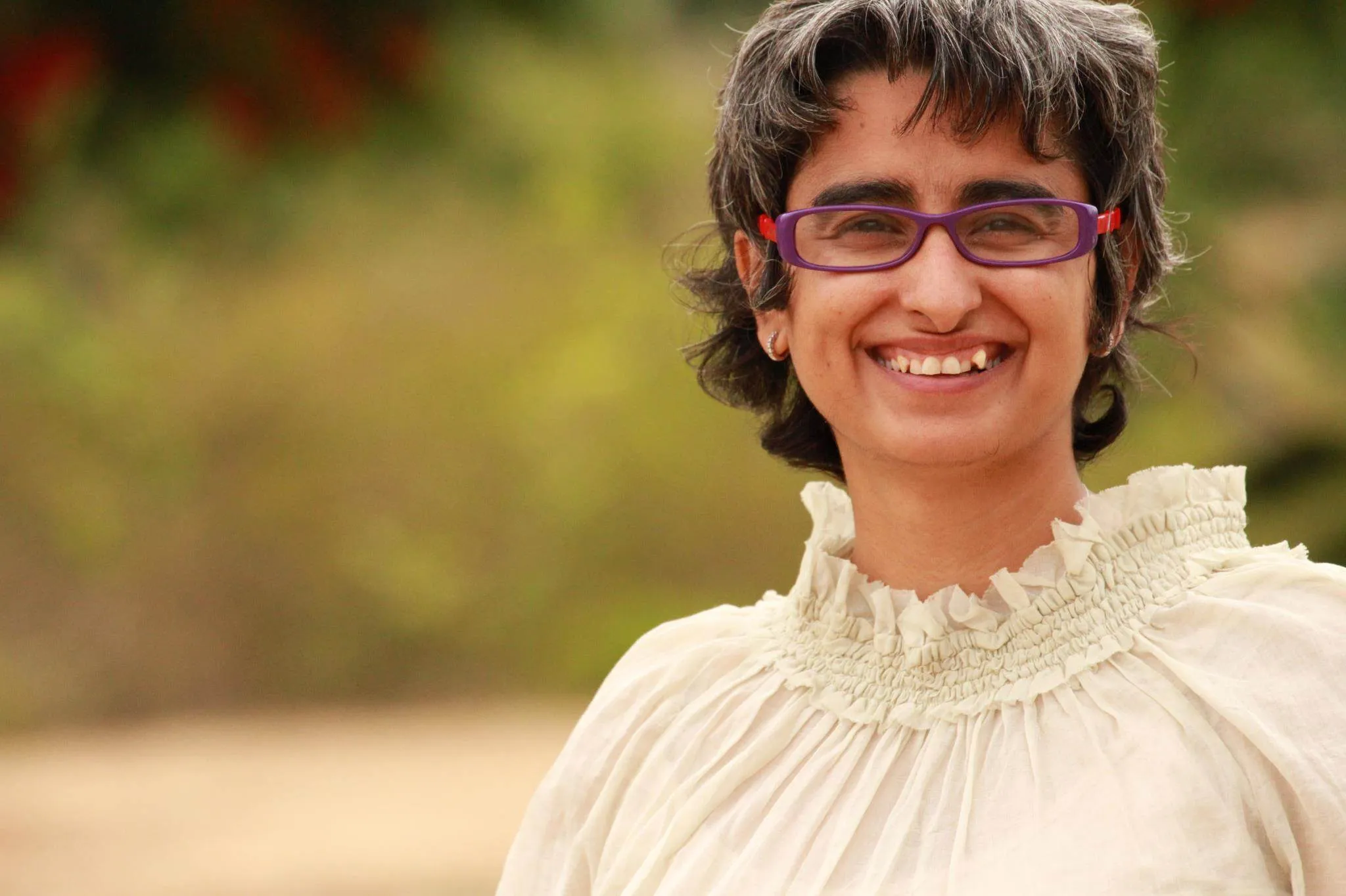 Shreya Chugh guiding a joyful group through yoga and breath practice